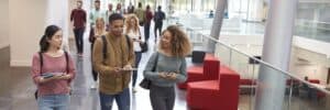 Students-walk-and-talk-using-mobile